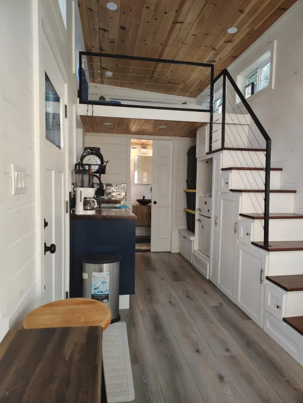 Photo of the kitchen and loft of a tiny house built by North Andes Homes.